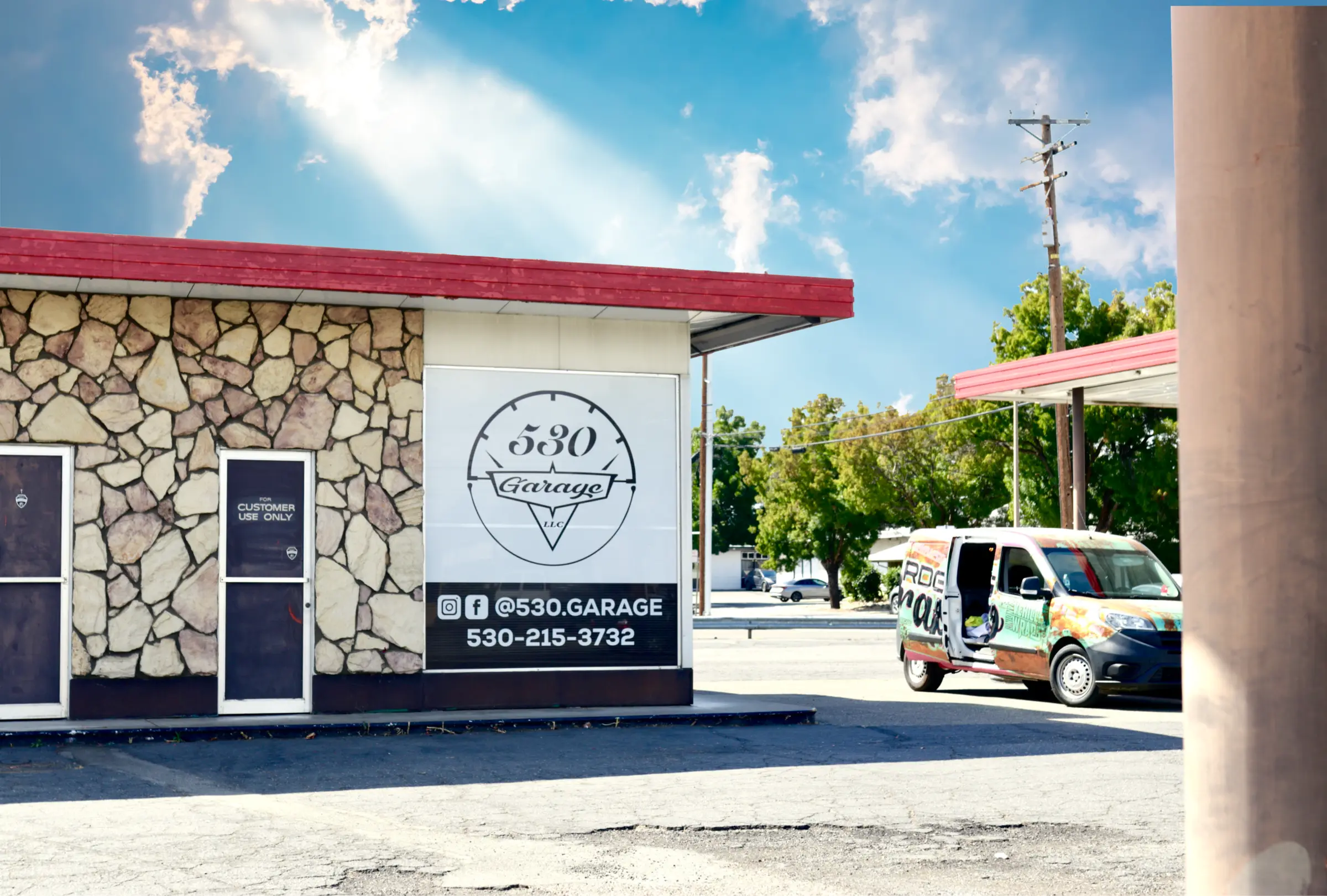 530 Garage storefront with window graphics and signage by the shop